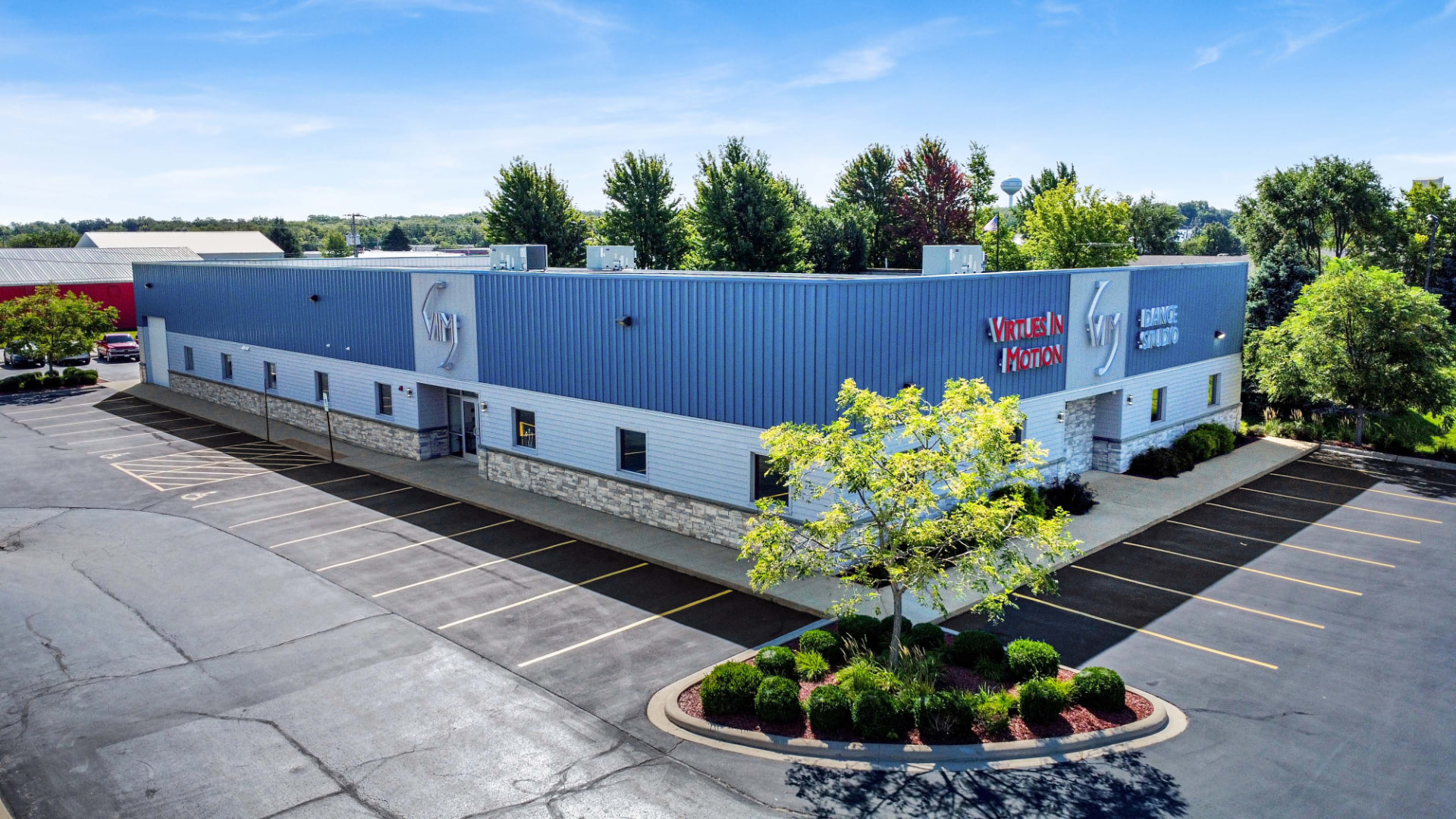 The blue and white Virtues In Motion Dance Studio building in Yorkville, Illinois